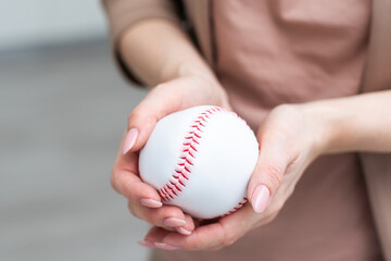 Small toy baseball isolated on white background