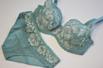 Lingerie. Light blue bra and panties on a white background. Lace set of women's underwear.