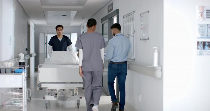 Healthcare professionals transport a patient in a hospital corridor