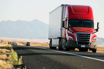 A big red tractor truck on the plains of Arizona