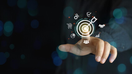 Businessman throwing red arrow dart to virtual target dart board. Setup objectives and target for business investment concept, Digital marketing, Business goal and technology concept.