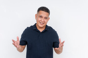 Smiling Asian adult male gesturing with his hands, conveying friendly explanation, isolated on a...