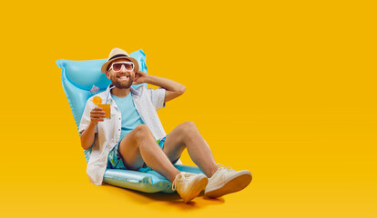 In the spirit of summer holidays, a man lounges on an inflatable mattress, in summer attire. With a...