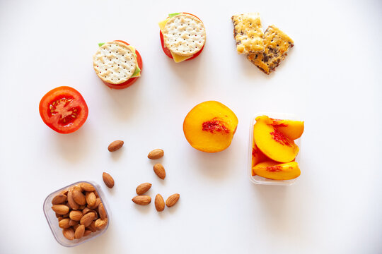 healthy snack foods laid out on white bench