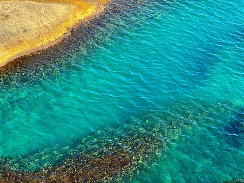 Clear blue sea water on the beach beautiful aerial view.
