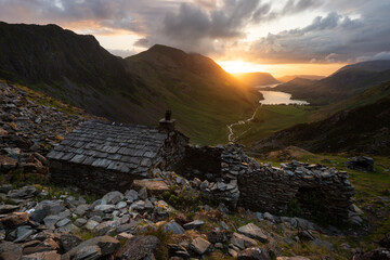 Dramatic sunset at Warnscale Bothy with views of Buttermere and Crummock Water in The Lake District, UK. - 738611480
