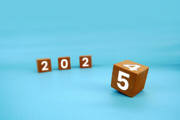 Wooden block with text 2025. Concept of new year 2025, beginning of success, challenge or career...