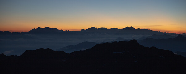 Sunset and mountain silhouettes