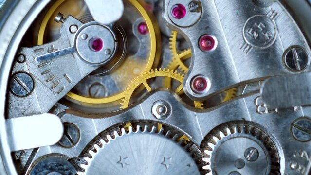 macro clockwork mechanism of an old Watch disassembled with cogwheels running slowly on silver steel hands gear movement working close up detail antique Pocket watch, Clock, Analog, Vintage,Mechanical