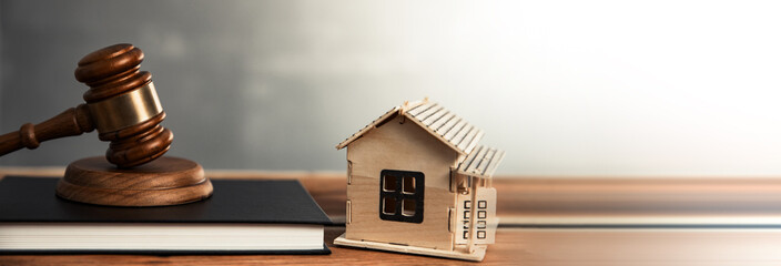 house model with judge on book