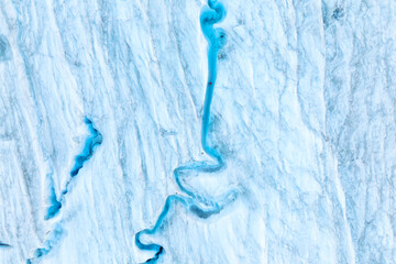 An aerial view of an iceberg and river. Winter landscape from a drone. View of the moraines. Landscape from the air. River on a moraine. © biletskiyevgeniy