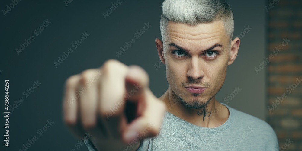 Poster a man with white hair pointing directly at the camera. this image can be used to convey a sense of a