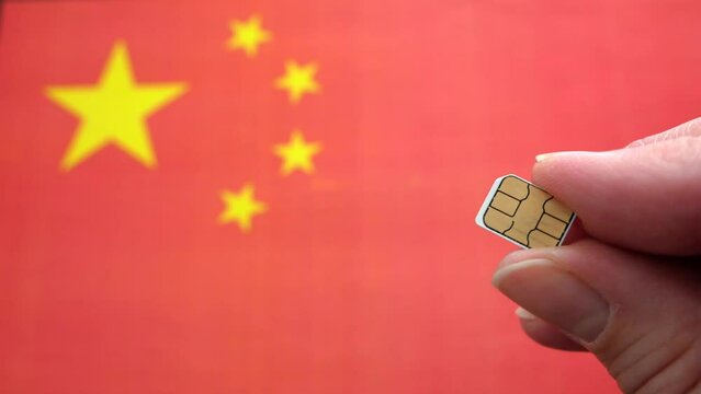 China flag and sim card in hand, concept