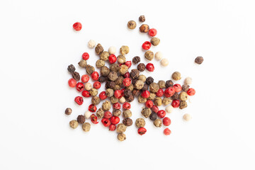 Pepper mix of red, black, white and green peppercorns on white background. Organic spice 