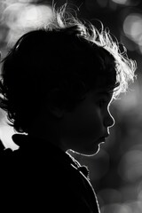 A black and white photo of a young boy. Suitable for various creative projects
