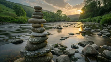 Fotobehang Oval stones stacked on the riverside © Jennifer