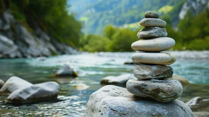 Poster Oval stones stacked on the riverside © Jennifer