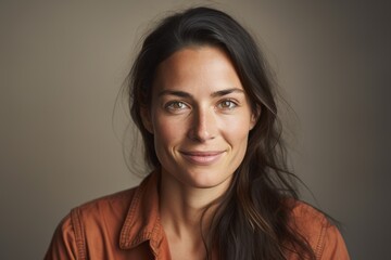 Portrait of a beautiful young woman with long black hair and brown eyes