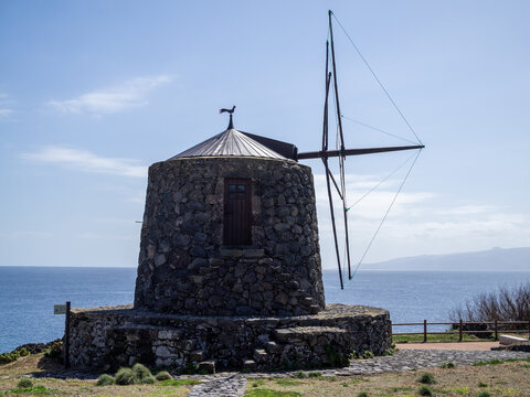 Volcanic rock windmill by the sea in Corvo Island, Azores