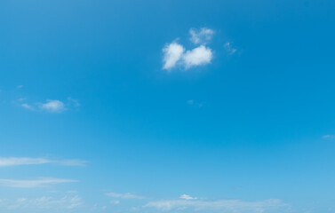Naklejka na ściany i meble Blue sky with small white clouds