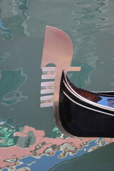 detail of the bow of the Gondola the typical boat for transporting tourists in Venice in Italy