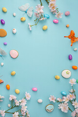 Fototapeta na wymiar Easter concept background eggs and cookies on blue surface