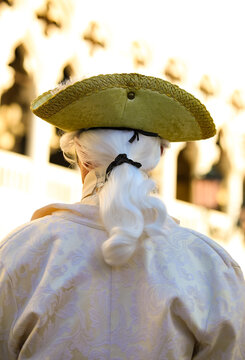 hat of nobleman and wig of the masked man during the Venice Carnival celebrations in Italy and the ancient palace