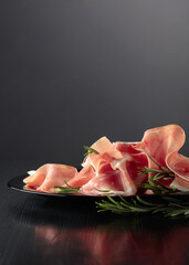 Italian prosciutto or Spanish jamon with rosemary.
