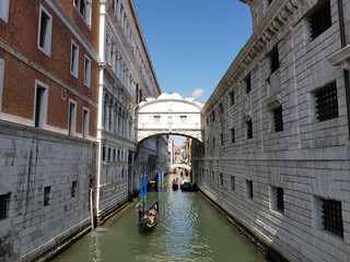 Gondolas on a canal under the Bridge of Sighs in Venice