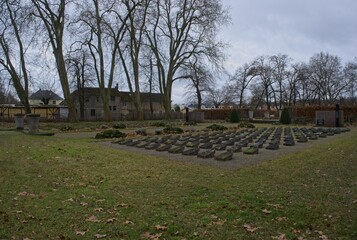 Treuenbrietzen, Germany - Feb 3, 2024: This cemetery contains the remains of hundreds of German civillians and POW's who were murdered by Soviet troops in April 1945. Cloudy winter day Selective focus