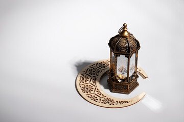 Ramadan Mubarak, white background, crescent moon, traditional lantern, holy month