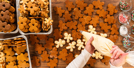 Making Festive Gingerbread Sandwiches on Rustic Wooden Table