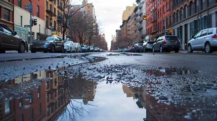 Behangcirkel Street in New York City with puddles as reflection. © Salman