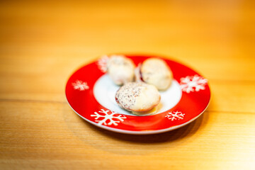 Various homemade cookies from the Christmas bakery on a small plate.