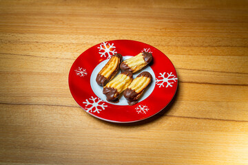 Various homemade cookies from the Christmas bakery on a small plate.