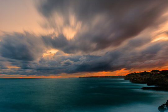 long exposure ,Panoramic view of the sea against the cloudy sky during sunset in the Mediterranean Sea. Mallorca,Balearic Islands,Spain