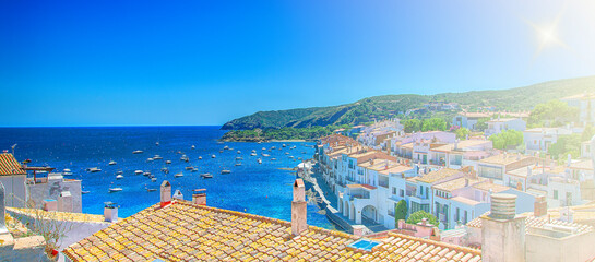 View on Street in Cadaques, Catalonia, Spain near of Barcelona. Scenic old town with nice beach and clear blue water in bay. Famous tourist destination in Costa Brava with Salvador Dali landmark