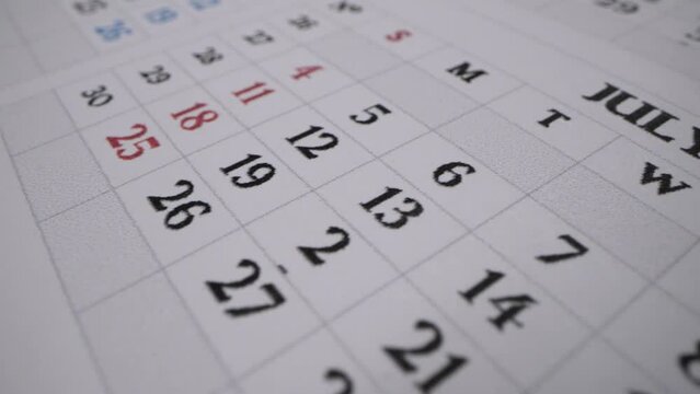Calendar July 2024. Sheets of calendars in macro shot. Important days. Independent day in America. July 4th. Big holiday in USA