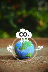 Explore a small world globe symbolizing CO2 reduction and net zero emissions by 2050. Embrace the...