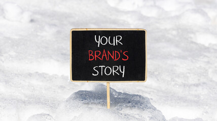 Branding and your brand story symbol. Concept words Your brands story on beautiful black chalk blackboard. Beautiful white snow background. Business branding your brand story concept. Copy space.