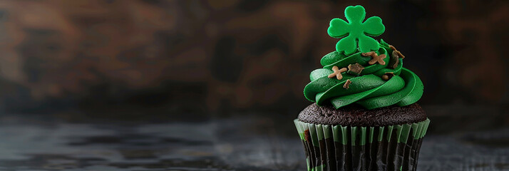St. Patrick's Day cupcake adorned with shamrock topper.Copy space. - St Patrick's day concept