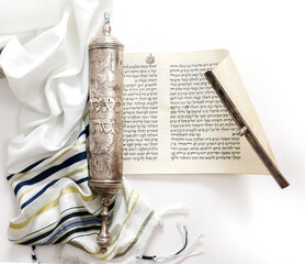 The Scroll of Esther and Tallit on a white background. Jewish holiday Purim.