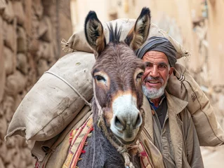 Fototapeten cargo donkey with owner © Comofoto