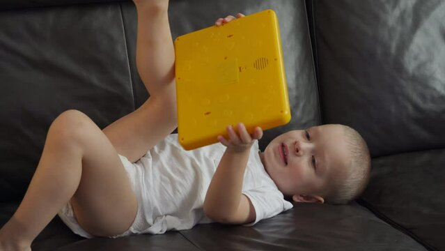 child learning alphabet on smarty alphabet tablet to learn letters, ABC, numbers, shapes, colors, music and words. Interactive toddler learning and education toys for kids boys and girls