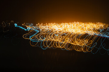 Abstract background of moving shot of lights of a traffic silhouette