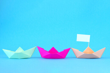 Paper Boats. One color paper boat as the Leader.