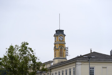 Main railway station at Slovenian City of Ljubljana with clock tower on a cloudy summer day. Photo...