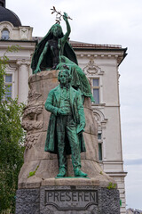 Sculpture of famous Slovenian poet France Preseren at the old town of City of Ljubljana on a cloudy...