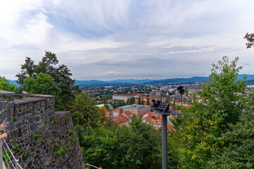 Aerial view of City of Ljubljana seen from Sance castle hill with mountain panorama in the...