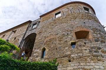 Looking up stone wall and tower with loophole of Castle of Ljubljana on a cloudy summer day. Photo...